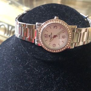 Premier watch face surrounded with clear stones